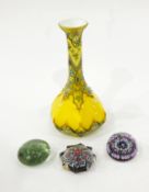 Yellow glass vase of bottle form with enamelled decoration,