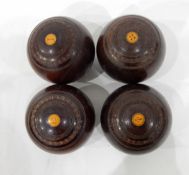 Four wooden bowling balls by Thomas Taylor of Glasgow