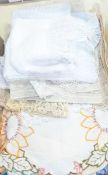 Embroidered and cut and drawn thread tablecloth, various crocheted table mats,