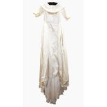 Cream satin wedding dress with boat-neck, deep collar, three-quarter length sleeves, full train,