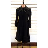 Vintage wool crepe coat trimmed with black astrakhan with a quilted satin lining