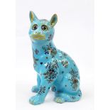 Possibly Mosanic cat in seated position with floral pattern, on dusty blue ground, glass eyes,