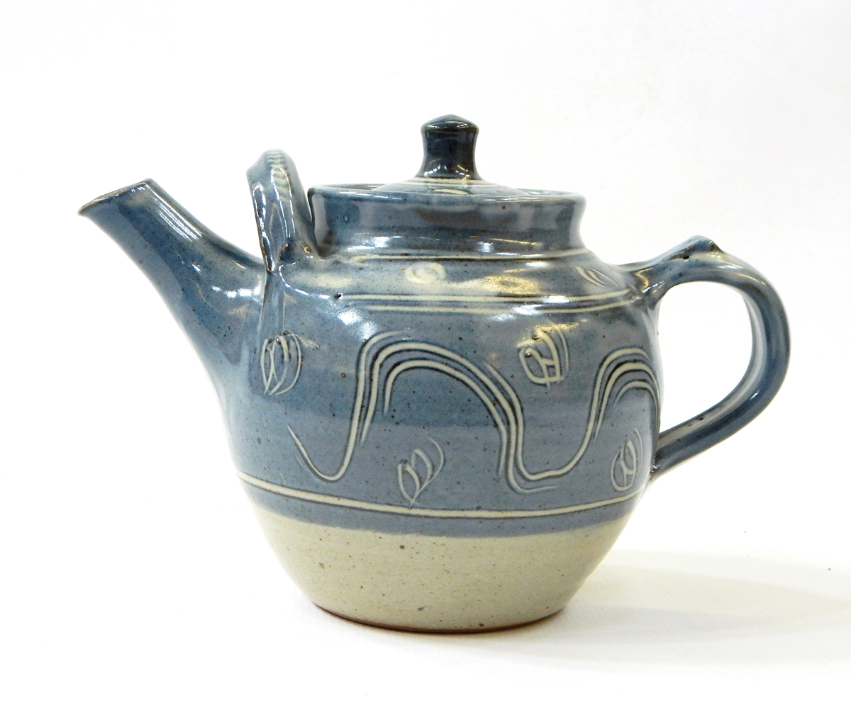 Ray Finch Winchcombe ash glazed teapot with combed and sgraffito decoration through blue slip,