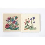 Two hand-painted tiles with floral decoration