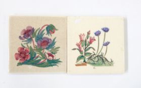 Two hand-painted tiles with floral decoration