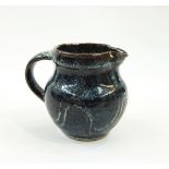 Ray Finch Winchcombe small pitcher, blue ground with wax resist meander decoration, stamped to base,