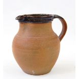 Winchcombe pottery jug, baluster shaped with brown rim, stamped indistinctly to base,