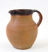 Winchcombe pottery jug, baluster shaped with brown rim, stamped indistinctly to base,