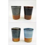 Ray Finch Winchcombe set of four glaze trial beakers, various ash finishes, stamped to base,