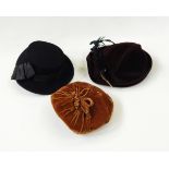 Two 1950s hats with feather decoration (one black, one burgundy), black 1930s velour hat,