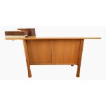 Ercol sideboard on circular tapered supports,