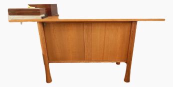 Ercol sideboard on circular tapered supports,