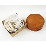 Two leather collar boxes, a large quantity of stiff collars and white ties,