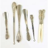 Pair of silver handled glove stretchers, silver handled button hook, three similar shoe-lifts,