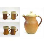 Ray Finch Winchcombe wood fired coffee pot and four mugs with cream slip to rims,