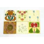 Collection of tiles to include a blue and white floral decorated tile,