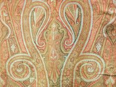 Large woven paisley shawl in shades of red, green, black and pale blue, tasselled ends, approx.