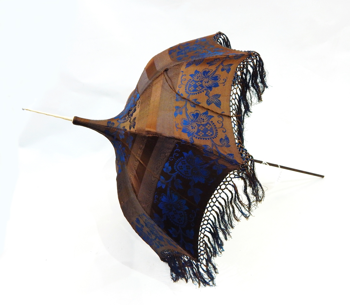 Edwardian brown and blue silk parasol with fringe and bone terminal and a brown silk and cream