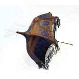 Edwardian brown and blue silk parasol with fringe and bone terminal and a brown silk and cream