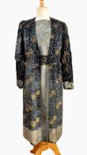 1930's printed gold brocade pan velvet dress with a sur-coat fastened by six black satin buttons,