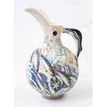 Ceramic ewer with fish and shell decoration, fish handle,