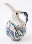 Ceramic ewer with fish and shell decoration, fish handle,