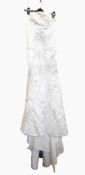 White satin strapless full-length wedding dress embroidered with silver thread and sequins,