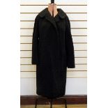 Black astrakhan coat labelled 'Emerson & Co, 74 George Street,