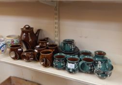 Holkham pottery coffee service decorated in brown glaze, with integral handles,