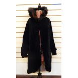 Black velvet knee-length opera cloak with quilted and fur stand-up collar,