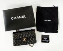 Chanel quilted handbag with brass-coloured metal fittings, stamped inside 'Chanel, Made in France',