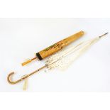 Cotton broderie anglaise parasol with faux-bamboo handle and a silk tassel,