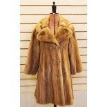 Three-quarter length mink coat with double-breasted buttons