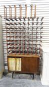 Two open wine racks together with a record cabinet containing a quantity of LP records,