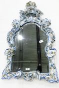 Meissen style porcelain wall mirror in the shape of a shield,