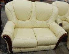 Three piece leatherette suite comprising two seater sofa and a pair of matching armchairs