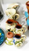 Quantity of Devon pottery to include 'Pixie Fine' and 'Pixie Gay' decorated jugs,