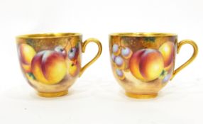 Two 20th century Royal Worcester miniature coffee cups and saucers, gilt interiors,