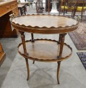 Oval tray-top tea table with carrying handles to top, undershelf below, on turned column supports,
