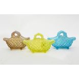 Three Victorian pressed glass baskets, probably by Henry Greener, one yellow,