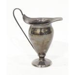 Edwardian silver cream jug of plain baluster form, raised on a circular foot, height 12cm,