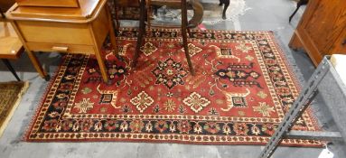 North Afghan wool kargahi rug from Masor-E-Sharif with deep red ground, central field,