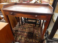 Early 19th century mahogany wash stand with gallery surround top, long frieze drawer,