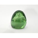Victorian large green glass dump paperweight with internal decoration of a figure seated on an