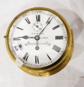 Reproduction brass ship's bulkhead clock with enamel dial,