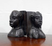 Pair of African carved hardwood busts of women, a pair of bookends, elephant ornaments, etc.