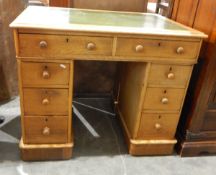 Light oak pedestal desk with inset leather writing surface,