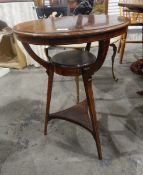 Late Victorian rosewood circular top occasional table with two under-shelves on square tapering
