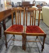 Three oak rail-back dining chairs with upholstered drop-in seats,