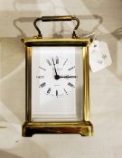 Carriage clock in lacquered brass case, the dial with Roman numerals and inscribed "Martin & Co,